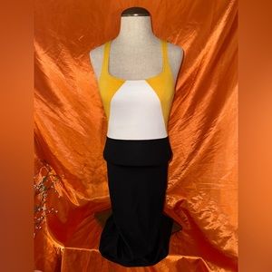 Yellow, white and black dress with a slit in the back